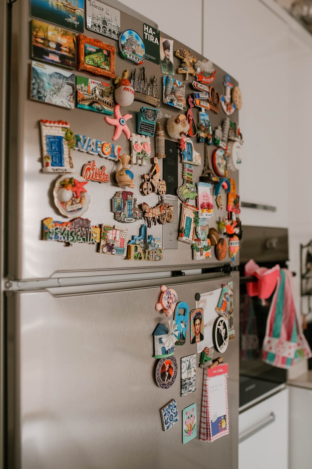 Collection of photo magnets on a fridge